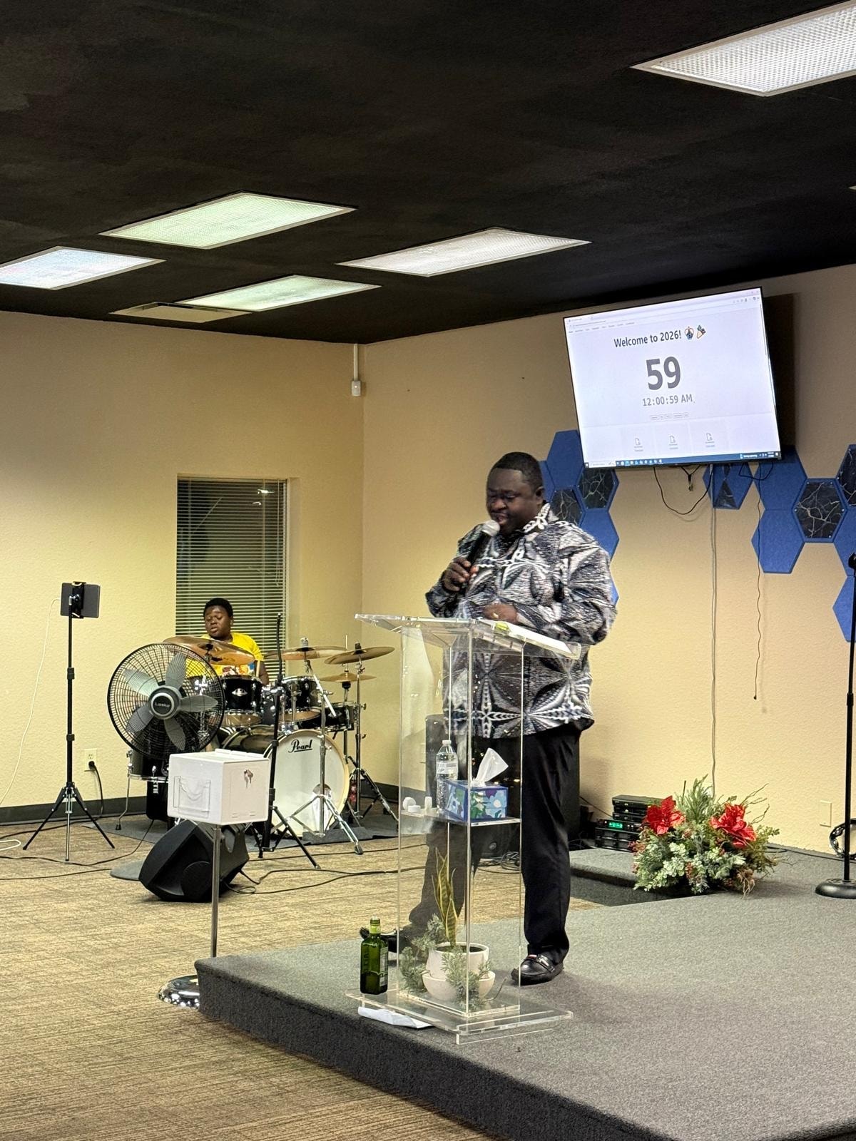 Pastor preaching at THM service